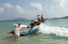 China - Hainan Island: launching fishing Boat  (photo by G.Friedman)