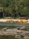 China - Hainan Island: beach - boats, rocks and palmtrees (photo by G.Friedman)