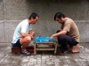Beijing / Peking, China: man playing Go - geme of Go - photo by G.Friedman