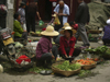 Dali, Yunnan Province, China: market scene - vegetable sellers gossip - photo by M.Samper
