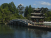 Lijiang, Yunnan Province, China: Dragon Park - pagoda and stone bridge by the water - photo by M.Samper