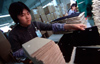 Dongguan, Guangdong province, China: Chinese factory workers - packaging - photo by B.Henry
