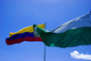 Medelln, Colombia: flags of Medelln and the Colombian Republic against a blue sky - photo by E.Estrada