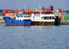 Moroni, Grande Comore / Ngazidja, Comoros islands: boats and containers - port scene - photo by M.Torres