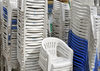 Moroni, Grande Comore / Ngazidja, Comoros islands: piles of plastic chairs from a 'Grand Mariage' wedding party - Place de Badjanani - photo by M.Torres