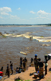 Djou, Congo: Livingstone Falls / Chutes du Djou - rapids on the lower course of the Congo River, border between the Congos - people bathing and washing clothes -  photo by M.Torres