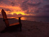 Cook Islands - Rarotonga island: chair overlooking sunset at Black Rock beach - photo by B.Goode