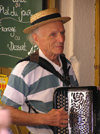 Corsica - Bonifacio: old man playing accordion - senior citizen (photo by J.Kaman)