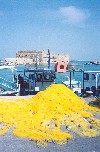 Crete - Heraklion / Iraklio / HER: fishing nets - old harbour - fortress in the background