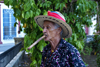Camagey, Cuba: man smoking a colossal cigar - photo by A.Ferrari