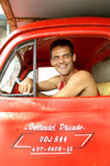 Cuba - Holgun - driver of a classic 1950's era Ford truck poses for the camera - photo by G.Friedman