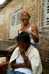 Cuba - Holgun - laughing during haircut - photo by G.Friedman