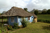 Cuba - Holgun province - blue house and green fields - photo by G.Friedman
