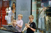 Copenhagen, Denmark: two boys playing trumpets on the street - music stand with sheet music - clothes shop windows - photo by K.Gapys