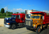 La Romana, Dominican Republic: American trucks head to San Domingo - Mack and International - photo by M.Torres