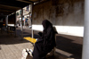Egypt - Alexandria:  muslim woman texting on a cell  phone (photo by John Wreford)