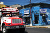 San Salvador, El Salvador, Central America: Alameda Roosevelt - bus and the strong colors of San Sivar - photo by M.Torres