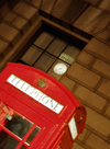 UK - London: BT - British telephone kiosk with reflection of Big Ben in window (photo by K.White)