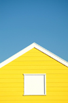 Southwold, Waveney district, Suffolk, East Anglia, East England: yellow beach hut - Southwold Beach - photo by K.White