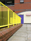 UK - England - Ellesmere Port: yellow railings and purple door, Cheshire Oaks Designer Outlet Centre (photo by David Jackson)