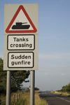 Lulworth to Wareham road, Dorset, England: warning sign for tanks crossing and sudden gunfire - photo by I.Middleton