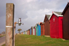 Calshot, Solent, Hampshire, South East England, UK: tap and colourful beach huts - photo by I.Middleton