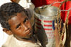 Eritrea - Hagaz, Anseba region - boy drinking water from a tin in a desert well - photo by E.Petitalot