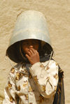 Eritrea - Senafe, Southern region: girl with a bucket on her head for sun protection - photo by E.Petitalot