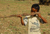 Eritrea - Mendefera, Southern region: a boy plays soldier with an old gun - photo by E.Petitalot