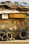 Eritrea - Mendefera, Southern region: an old tyre shop - Bridgestone sign - photo by E.Petitalot