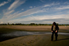Estonia - Parnu: Man in a hat walking on Parnu Beach - photo by K.Hagen