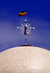 Addis Ababa, Ethiopia: St. Stephanos church - flag and cross with eggs above the dome - photo by M.Torres