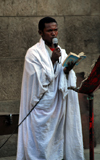 Addis Ababa, Ethiopia: St Ragueal church - priest celebrates mass outside - photo by M.Torres