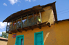 Gondar, Amhara Region, Ethiopia: colourful house with fragile balcony - photo by M.Torres
