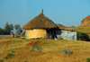 Gondar, Amhara Region, Ethiopia:hut with thatched and zinc annex - photo by M.Torres