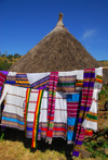 Tis Issat, Amhara, Ethiopia: Ethiopian scarves and village hut - photo by M.Torres
