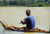 Lake Tana, Amhara, Ethiopia: fisherman at the outlet of the Blue Nile, the Abay - traditional boat - low-floating papyrus canoe, called tangwa - photo by M.Torres