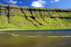 Kaldbaksfjrur fjord, Streymoy island, Faroes: green cliffs and floating nets, barrier used in sea farming - east coast of the island - photo by A.Ferrari
