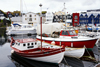 Trshavn, Streymoy island, Faroes: boats in the east harbour, Eystaravg - Tinganes in the background - photo by A.Ferrari