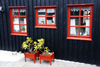 Trshavn, Streymoy island, Faroes: plants in red vases in front of a Faroese house of Tinganes - photo by A.Ferrari