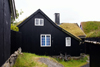 Trshavn, Streymoy island, Faroes: bike and Faroese sod roofed houses of Tinganes - photo by A.Ferrari