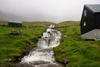 Mli, Boroy island, Noroyar, Faroes: waterfall and house in an almost abandoned village - photo by A.Ferrari
