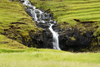 Husar, Kalsoy island, Noroyar, Faroes: small waterfall near the village - photo by A.Ferrari