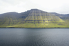 Kunoy island, Noroyar, Faroes: seen from Kalsoy - cliffs and the Kalsoyarfjrur - photo by A.Ferrari