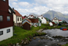 Gjgv village, Eysturoy island, Faroes: stream, houses and mountains - northeast tip of the island - Sunda Kommuna municipality - photo by A.Ferrari