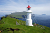 Mykinesholmur islet, Mykines island, Faroes: lighthouse at the western edge of Mykinesholmur - built in 1909, now automated - it is switched off in the summer, due to the light nights on the Faroes - photo by A.Ferrari