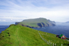 Mykinesholmur islet, Mykines island, Faroes: view over Mykines from the western edge of Mykinesholmur - the house on the left is the only one on the islet, built in 1920 for the lighthouse keeper - photo by A.Ferrari
