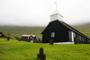Norragta village, Norragta village, Eysturoy island, Faroes: the old wooden church in the centre of the village, built in 1833 - grave stones - photo by A.Ferrari