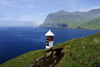 Srvgsfjrur fjord, Vgar island, Faroes: lighthouse perched over the sea - solar power operated - photo by A.Ferrari