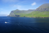 Srvgsfjrur fjord, Vgar island, Faroes: a fishing boat leaves for the ocean - bow waves - photo by A.Ferrari